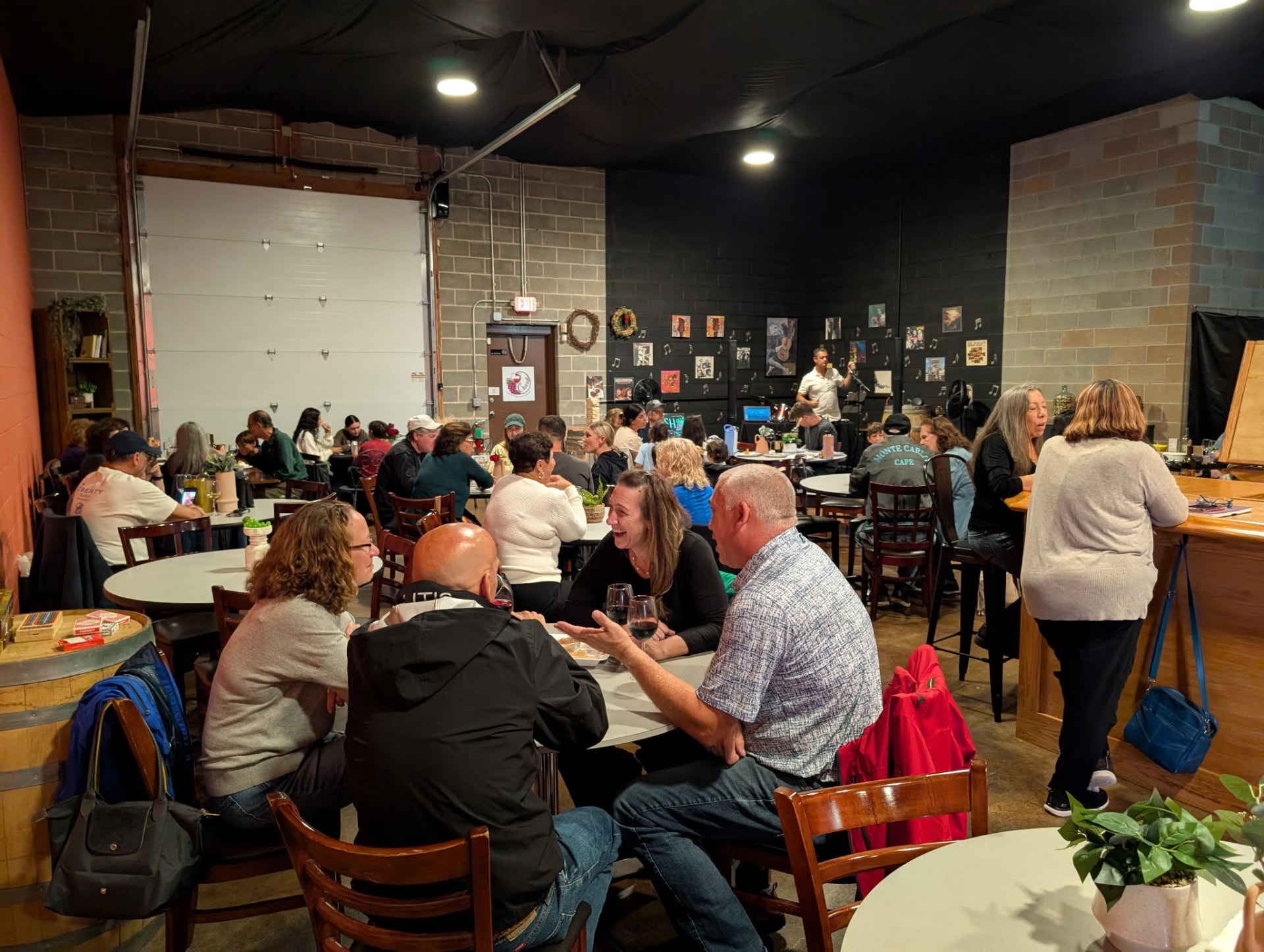 A full tasting room with guests enjoying wine at Crush Winery